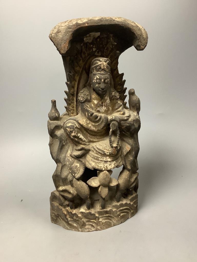 A Chinese lacquered wood seated figure of Guanyin, height 29cm